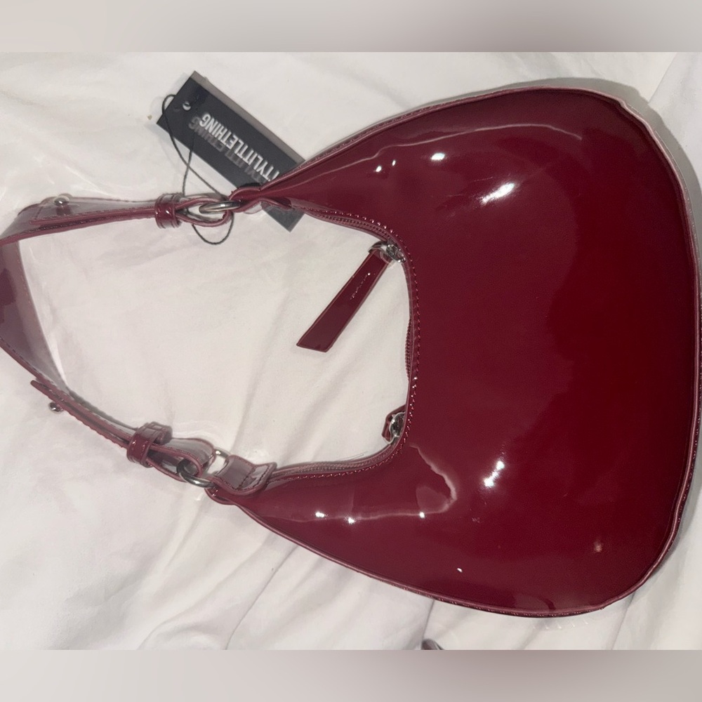 Matching red leather heels and red leather bag (both never used)